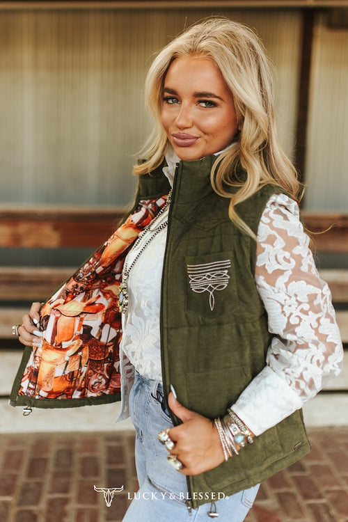 Lucky & Blessed olive quilted vest - open showing vibrant printed lining